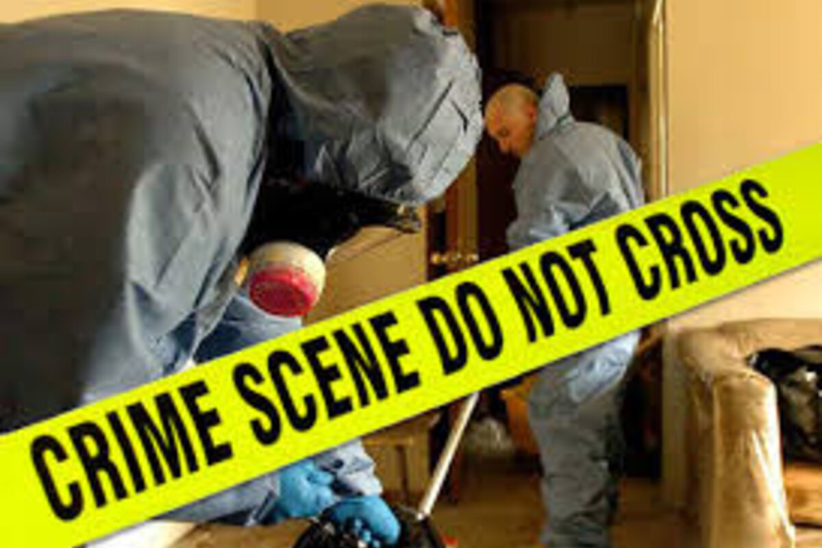 Protected specialists attending a blood clean up scene