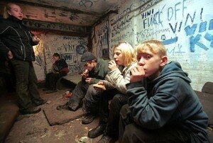 People inside a neglected drug den illustrating hazardous property conditions