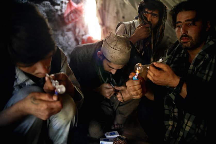People using drugs inside a neglected property illustrating drug den clearance conditions