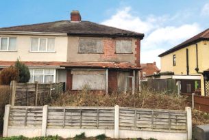 boarded up run down fixer upper house in Cavan