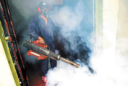 Pest control operative completing fumigation work in Belfast