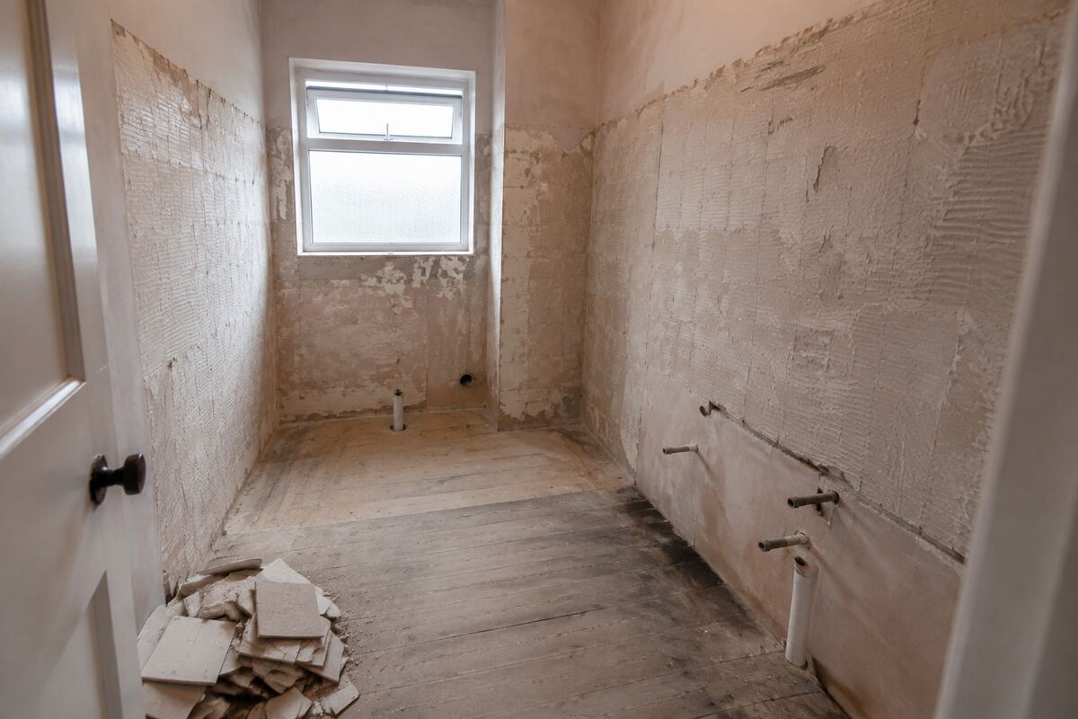 Stripped-out bathroom ready for professional restoration work